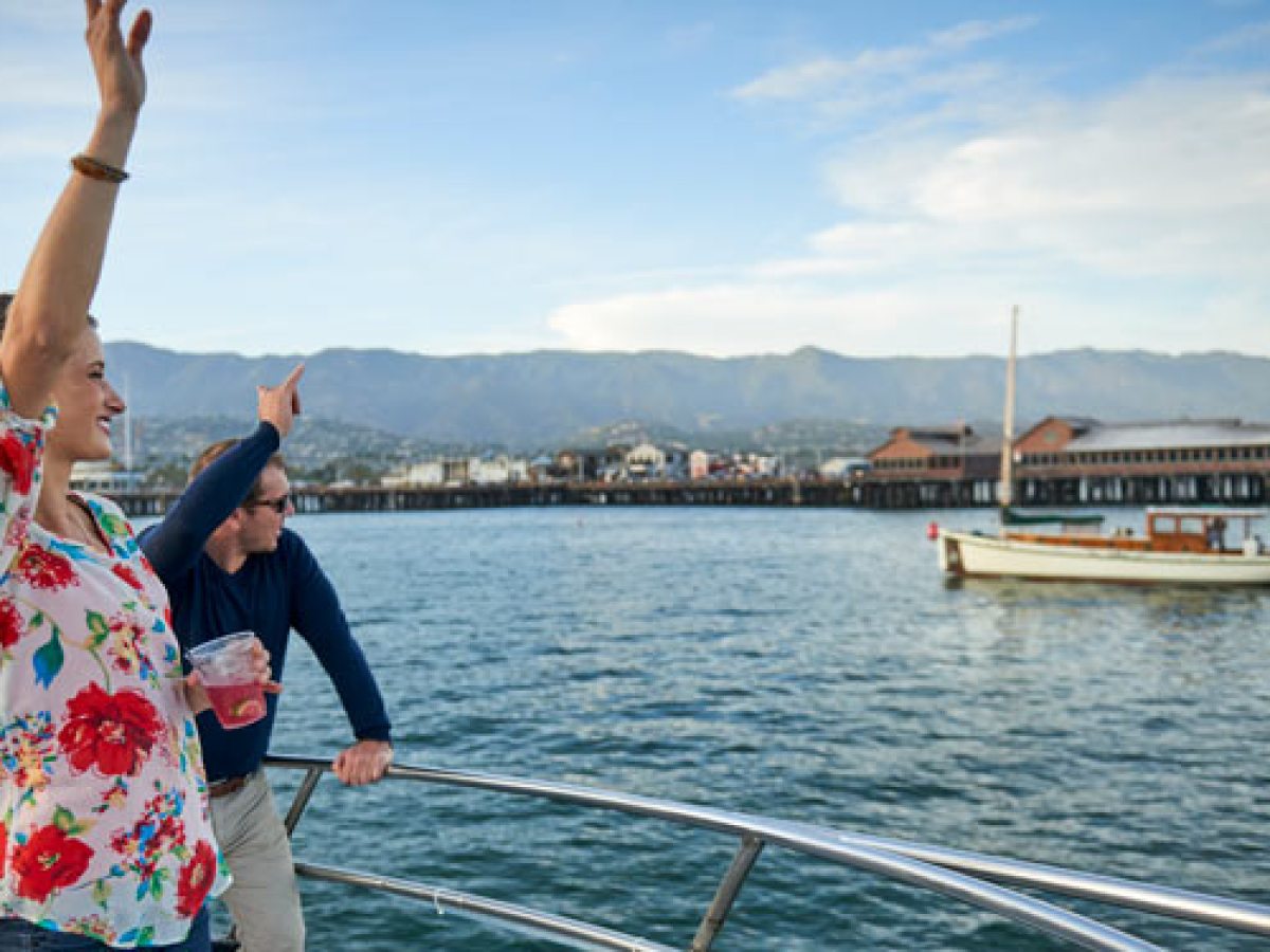 a person standing next to a body of water