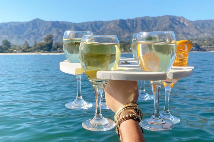 a man standing next to a body of water