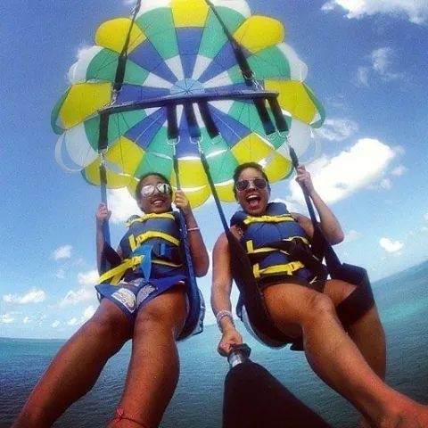 a person sitting next to a body of water