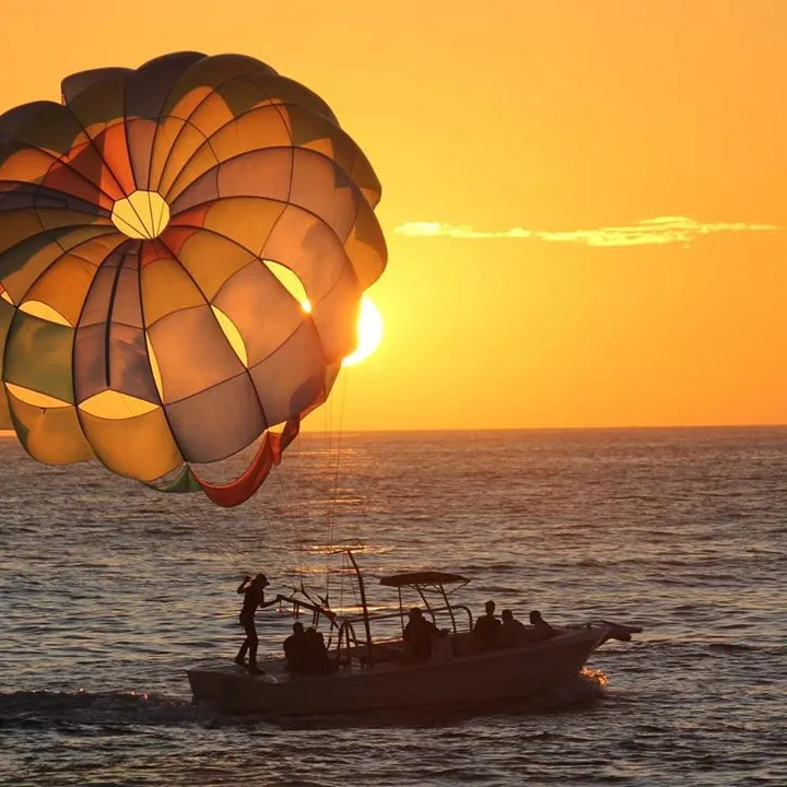 a boat sitting on top of a yellow umbrella